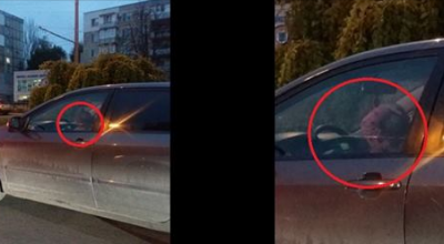 Şoferul surprins cu copilul în braţe în timp ce se afla la volan, a fost amendat de INP - Photo