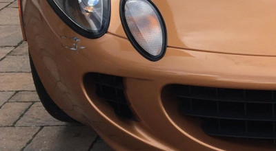 Din cauza unei zgârieturi pe bara din față acest Lotus a fost declarat daună totală! Află de ce - Photo