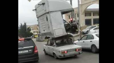 Niciodată să nu spui că le-ai văzut pe toate! Uite cum o LADA transportă cabina unui camion pe acoperiș - Photo